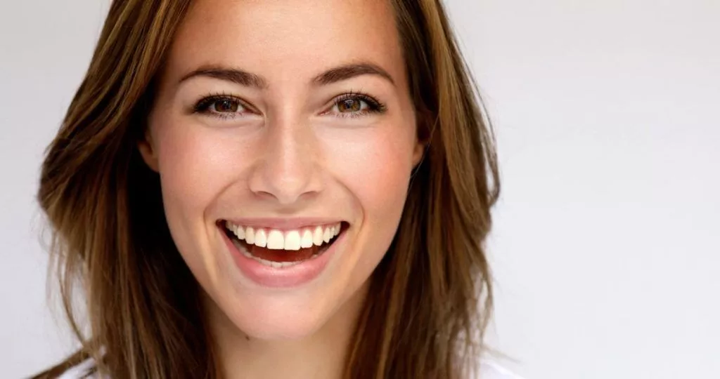 Enhance Your Smile with Porcelain Veneers at Corbin Dental Smiling person showcasing porcelain veneers