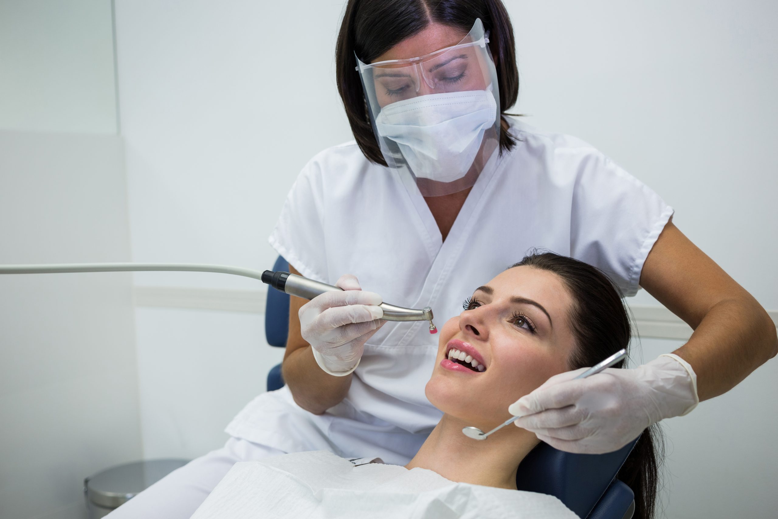 Smiling woman during cosmetic dentistry treatment