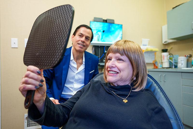 Patient Smiling into mirror