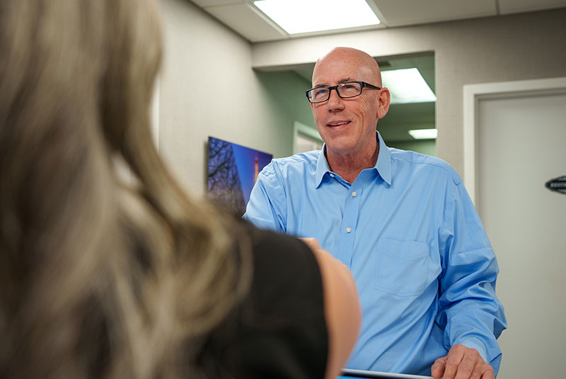 Patient shaking Team members hand