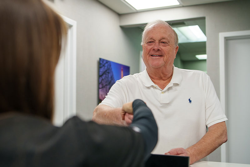 Patient shaking Team members hand