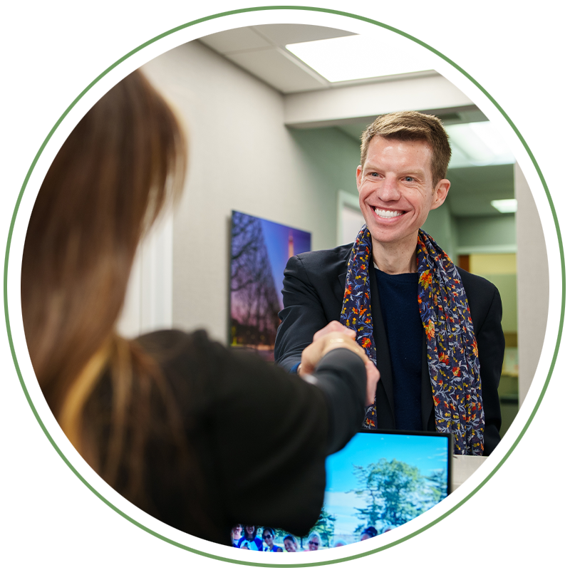 Patient shaking Team members hand