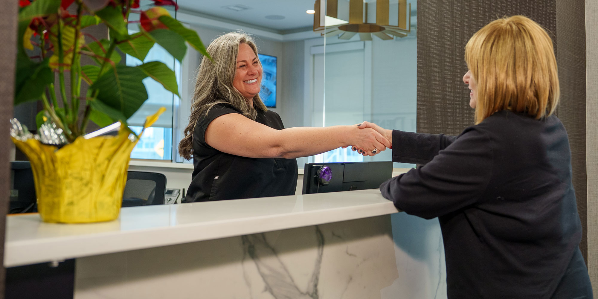 Patient shaking Team members hand