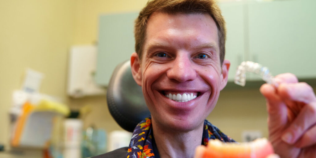 Patient holding invisalign