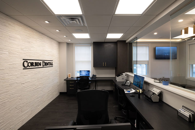 corbin dental sign behind desk Oyster Bay