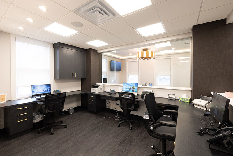 behind desk light fixture computers Oyster Bay